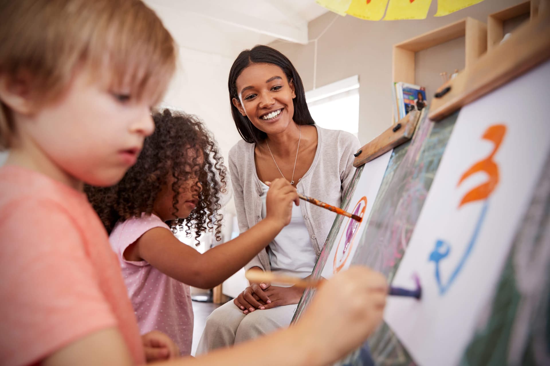 A Peyton’s Learning Place teacher with children in the classroom